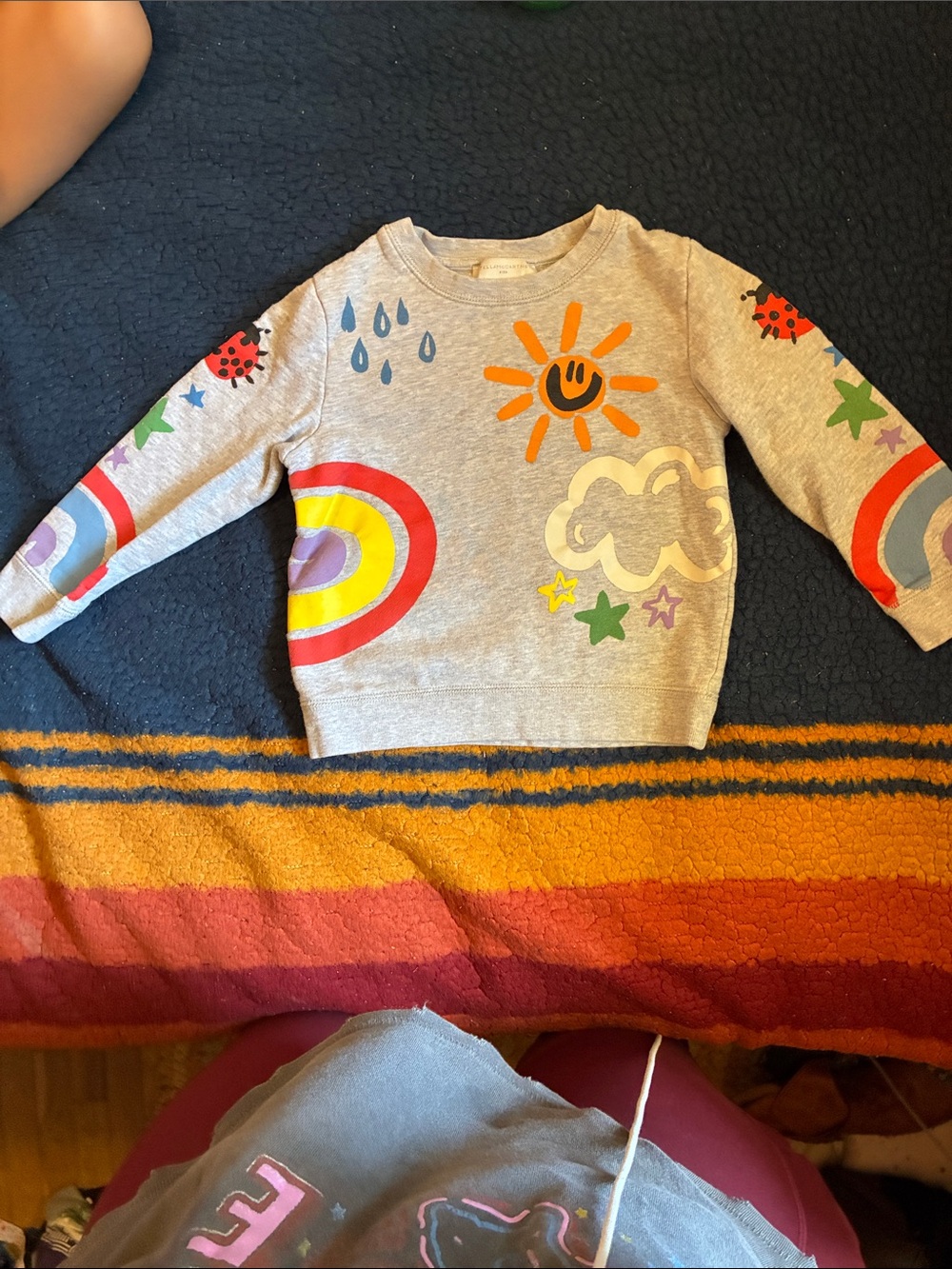 Stella McCartney Kids, playful crayon-style weather and rainbow print